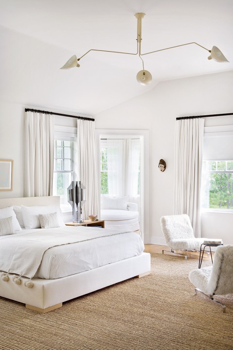 Warm white bedroom filled with texture