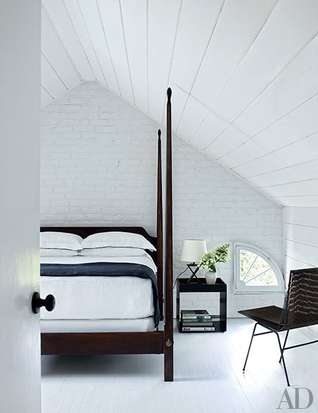 Bright white bedroom with vaulted ceilings