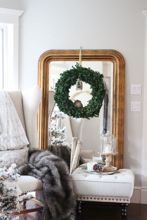 Boxwood wreath on a gilded mirror