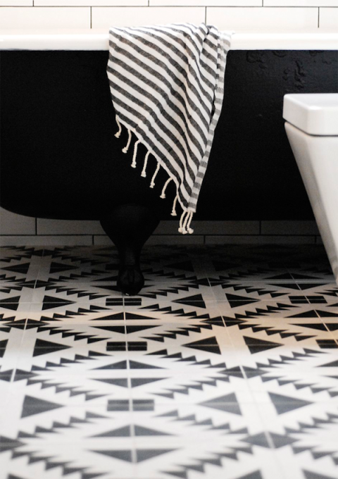 Black and white bathroom with graphic tile floor