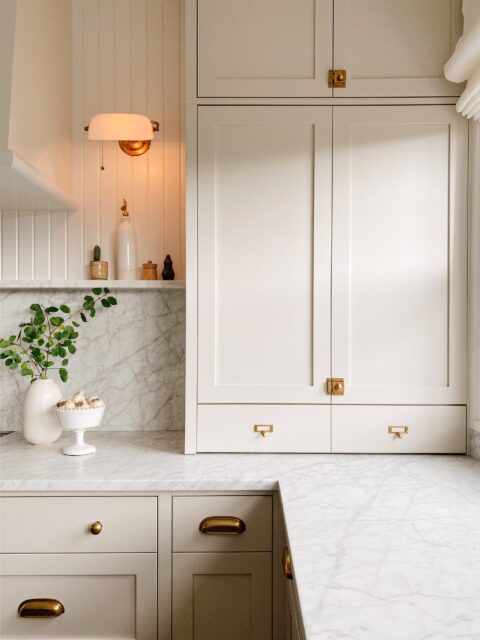 https://jacquelynclark.com/wp-content/uploads/2022/09/kitchen-inspiration-cream-cabinets-marble-counters-480x640.jpeg