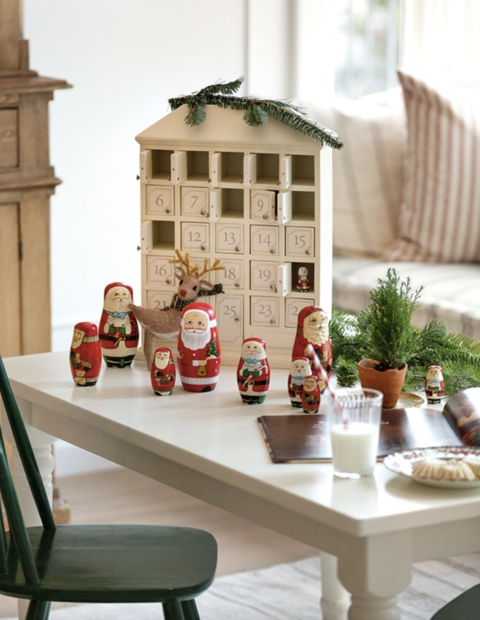 wood advent calendar and russian santa dolls